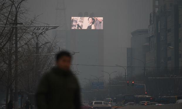 Pequim está encoberta pelo ar poluído desde sexta-feira / Foto: AFP